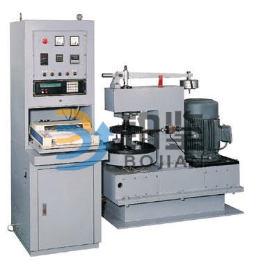 Microcomputer controlled speed friction and wear testing machine. Microcomputer controlled speed friction and wear testing machine.